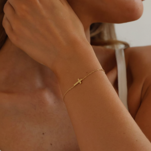 1:1 square cross bracelet on raised wrist